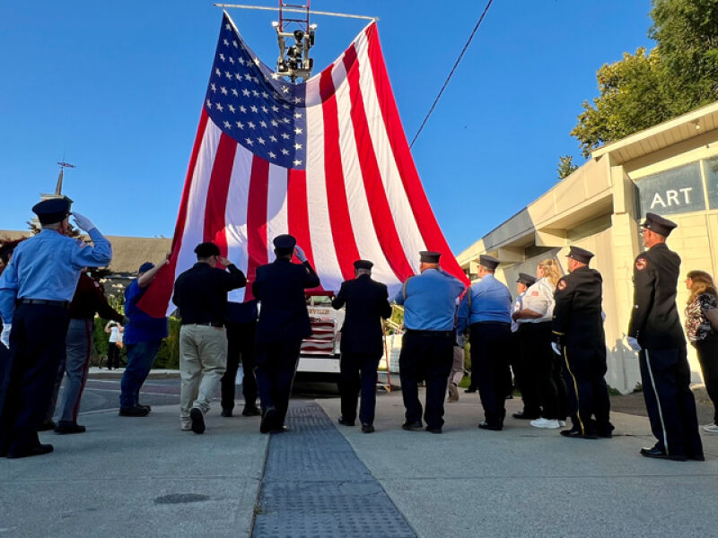 Raising the flag at the 2025 commemoration.