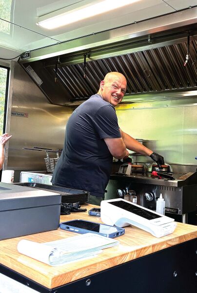 HIS OWN BOSS After years of working in food service and cooking for other business owners, Rob Evans decided to go into business for himself last year. Big Rob’s Food Service now comes to locations around the region in a large blue truck and serves up a variety of tasty dishes to eager customers.