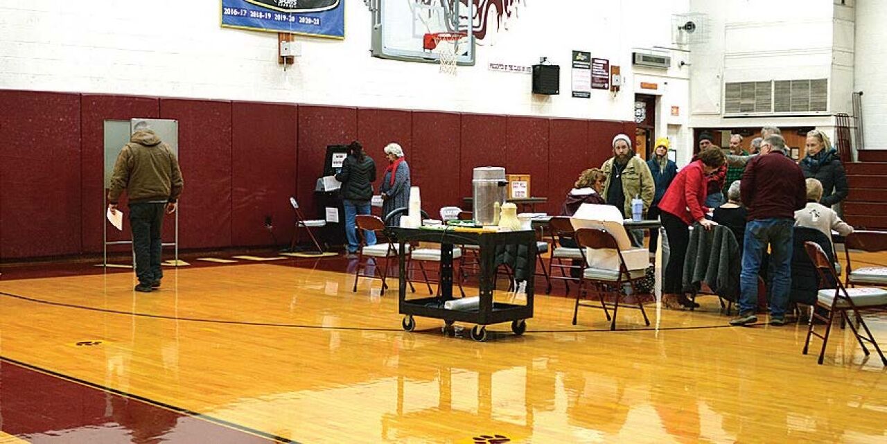 Town passes merger plan